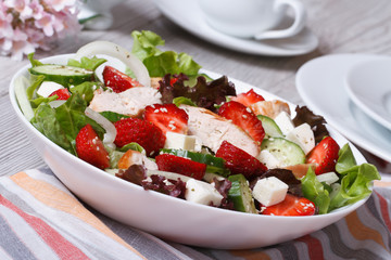 chicken salad with strawberries, vegetables and sesame seeds