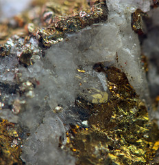 Nugget, gold, bronze, copper, iron. Macro. Extreme closeup