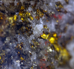 Nugget, gold, bronze, copper, iron. Macro. Extreme closeup