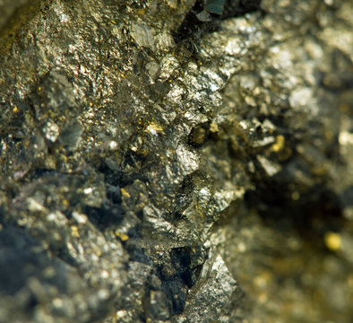Nugget, gold, bronze, copper, iron. Macro. Extreme closeup