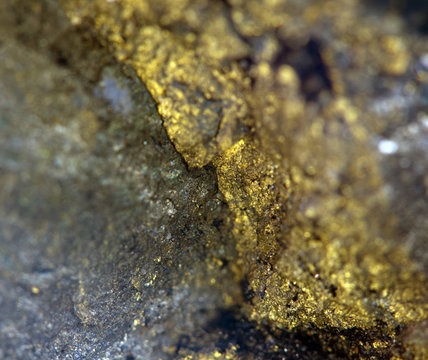 Nugget, gold, bronze, copper, iron. Macro. Extreme closeup