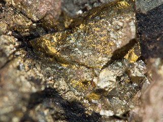 Nugget, gold, bronze, copper, iron. Macro. Extreme closeup