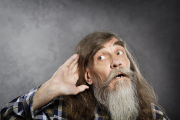 Senior listening, old man hold hand near ear. Deaf  loss rumor