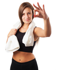 young sporty woman doing success symbol on white