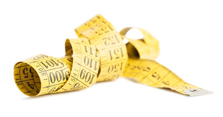 yellow measure tape isolated on a white background