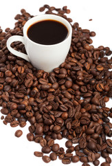 coffee cup and coffee beans isolated on white