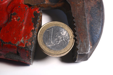 wrenchs and coins on white background