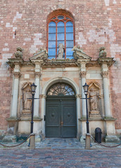 Fototapeta na wymiar Central portal (1692) of St. Peter church in Riga, Latvia