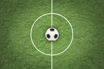 Soccer ball on green field. © natara