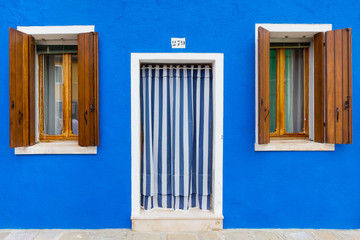 Blue building facade in Burano, Italy