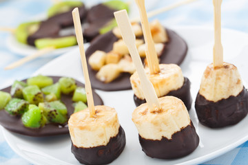 Banana with chocolate on a stick