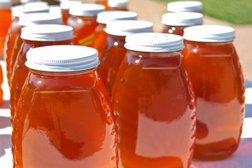 honey in glass jars at the market