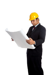 Asian engineer man reading a blueprint