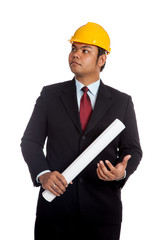 Asian engineer man about to hit a blueprint to his hand