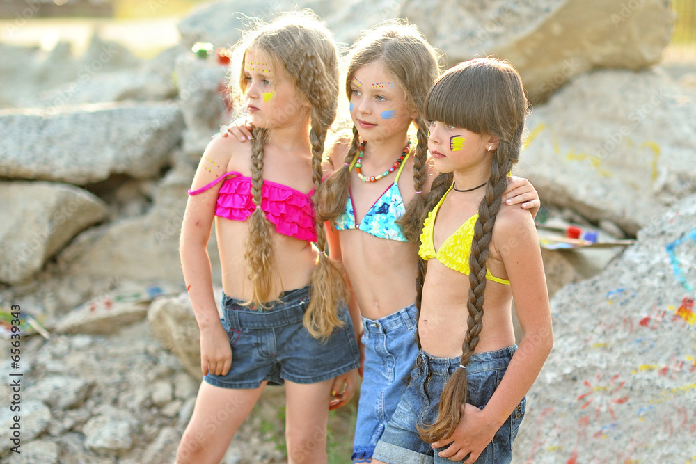 Wall mural Portrait of young children on a camping holiday