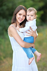 portrait of mother and little boy in summer