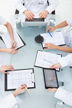 Doctors Examining Medical Reports