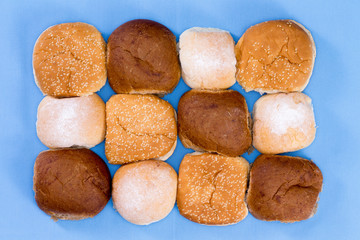 Variety of hamburger buns isolated on blue