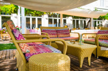 Colorful cushion on the garden furniture