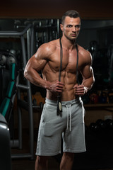 Fototapeta na wymiar Handsome Muscular Man With Jumping Rope - Cardio Time