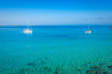 Obraz premium luxury yacht in turquoise Illetes Formentera mediterranean sea B