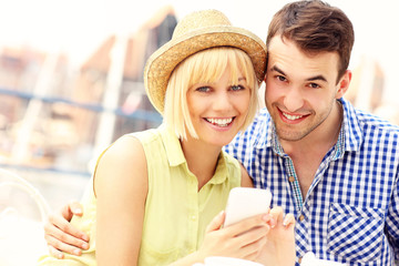 Young couple using a cellphone