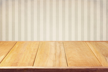 Background with retro srtiped wallpaper and empty wooden table