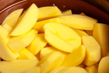 Closeup of raw peeled potatoes in pot or pan. Healthy food.