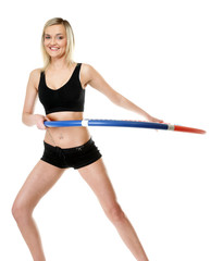 Fototapeta na wymiar young fitness woman with hula hoop isolated