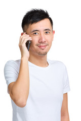 Happy smiling young man talking mobile phone