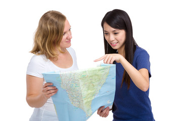Girl looking at map with different country