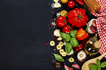 Fototapeta na wymiar Italian ingredients - pasta, vegetables, spices, cheese