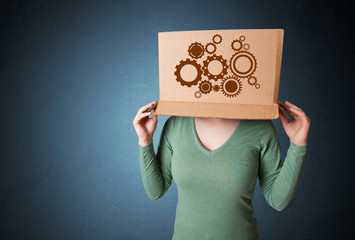 Young woman gesturing with a cardboard box on his head with spur