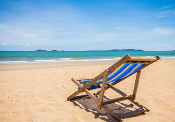 Canvas chair on beach and blue sky