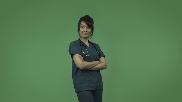 indian female doctor with arms crossed isolated on greenscreen
