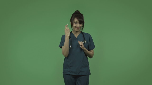 indian female doctor with fingers crossed isolated on