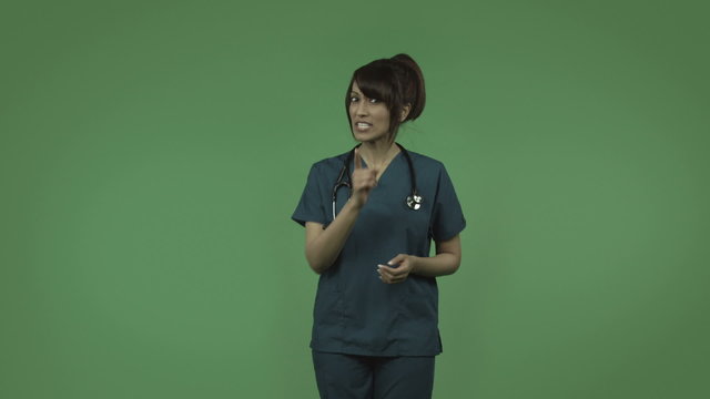 indian female doctor isolated on greenscreen upset talking for