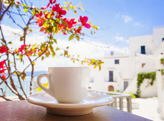 A cup of coffee with southern street at the background