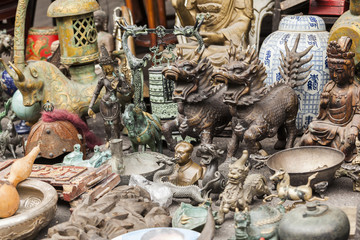 Souvenirs on Dongtai Lu antiques market in Shanghai, China.