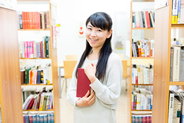 young asian woman in the library