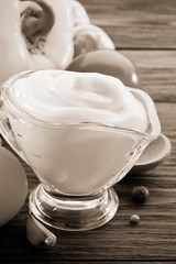 mayonnaise sauce in bowl on wood