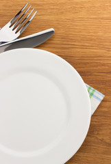 plate, knife and fork  at cutting board