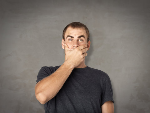 handsome man surprised and wondered man and dark background