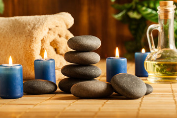 Fototapeta na wymiar Spa still life with hot stones and candles