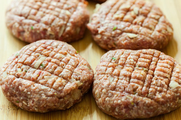 Hamburgers on cutting board