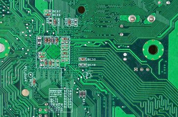 Close up of a printed green computer circuit board