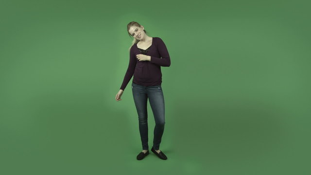 attractive casual caucasian girl isolated on green happy dance