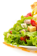 salad in plate on white