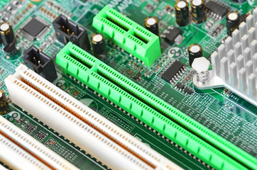 Fototapeta premium Printed computer motherboard PCI connector slot, Dof
