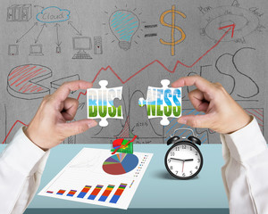 Hand assembling puzzles for green business in office